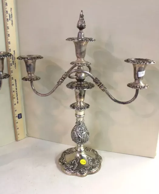 Pair of elaborate carved 3 burner silverplate candle sticks, good shape. 16"w x 2