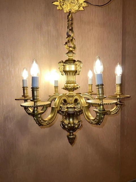 Lustre En Bronze Doré de style renaissance XIXème décor têtes de Mascaron