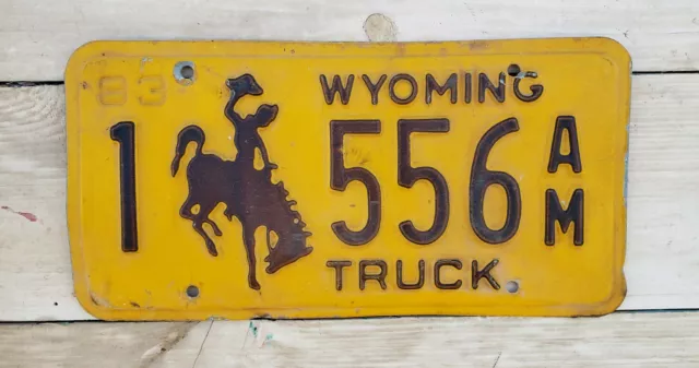 Vintage Wyomning 1983 License Plate Sign Truck # 1 556 AM Cowboy Horse Graphic
