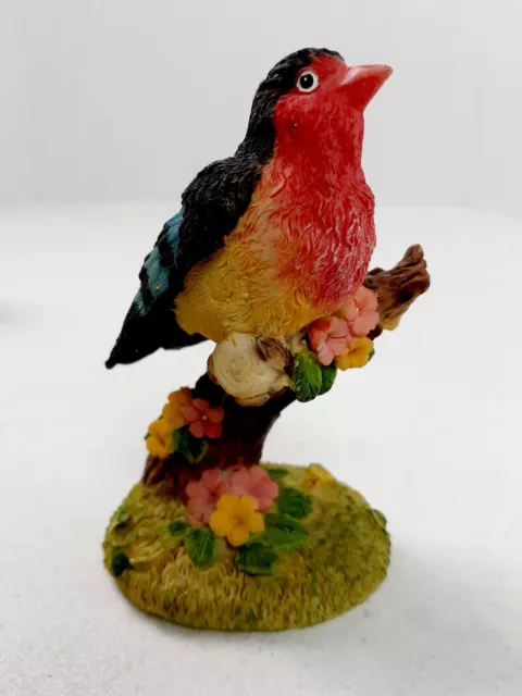 Colorful Bird On Stump Branch Decorative Figurine Resin 4" tall Red Yellow Blue