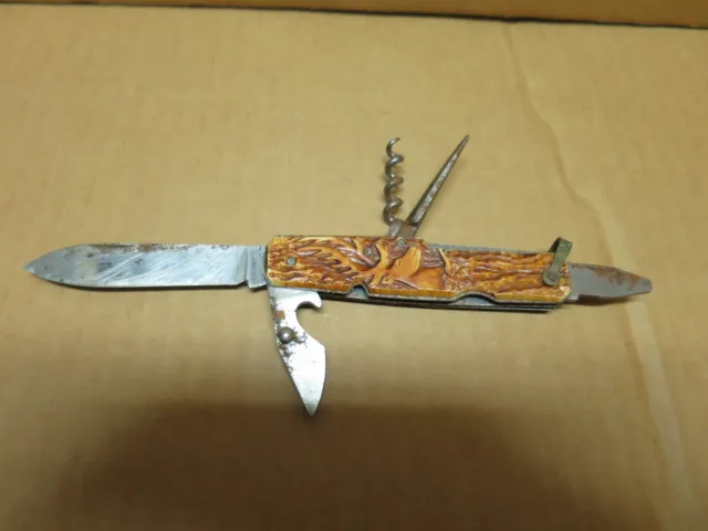 Ancien couteau de chasse pliant multifonctions plaquettes andouiller sculpté