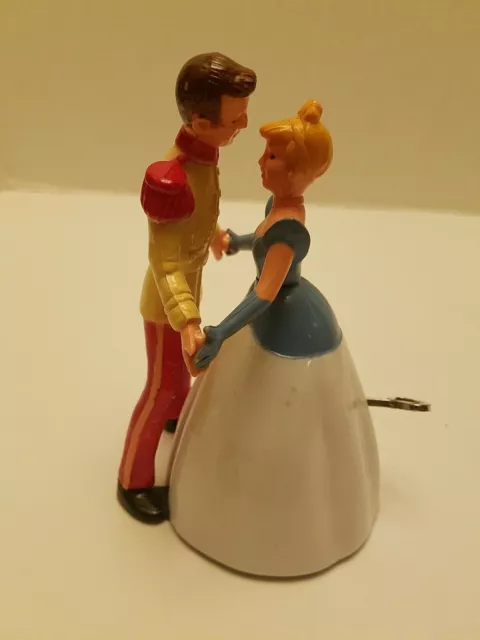 Irwin toys 1950s Disney Cinderella and the Prince wind up dancing figurines.