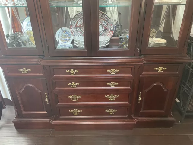 Curio cabinet with glass doors and drawers. Not scratch. Touch hinge Lighting. Curio cabinet with glass doors and drawers. Not scratch. Touch hinge Lighting.