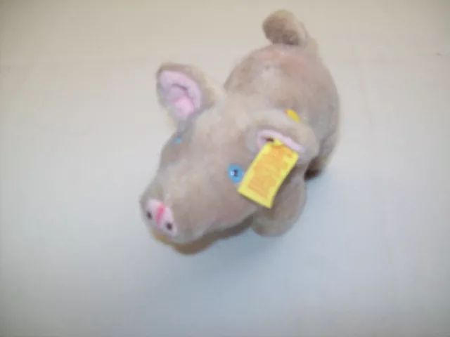 Steifftier-"Schwein-Piggy" mit Knopf im Ohr, Schildchen und Pappschild