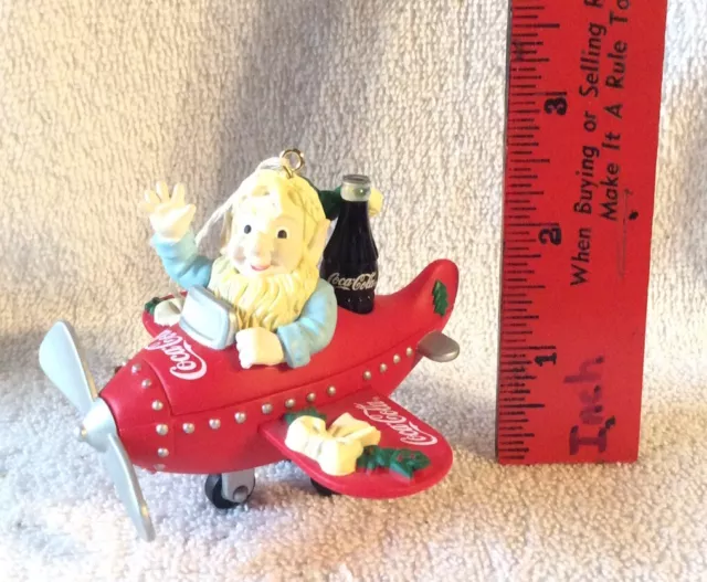 Coca Cola Elf Flying A Plane Christmas Ornament