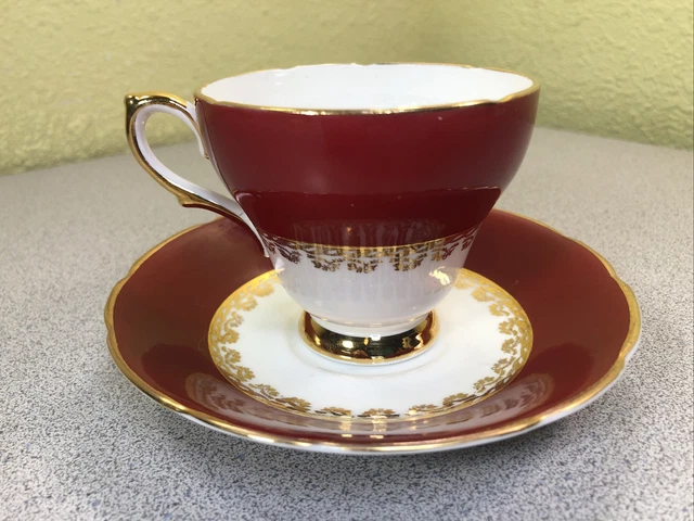 Taza de té y platillo vintage Sutherland hueso fino China Inglaterra dorado blanco y rojo