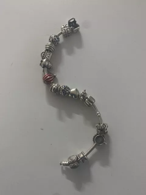 100% genuine Pandora bracelet with 15 genuine pandora charm. Excellent condition 2