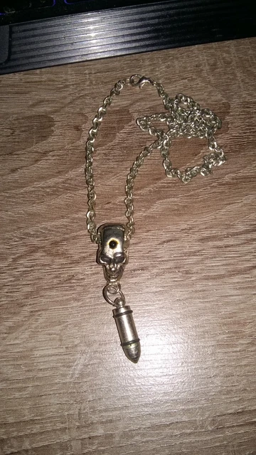 pendentif en acier avec chaîne - tête de mort + balle