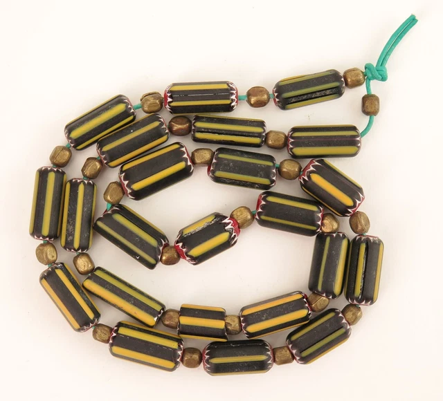 A strand of Venetian glass ‘yellow jacket’ African trade chevron beads c1910