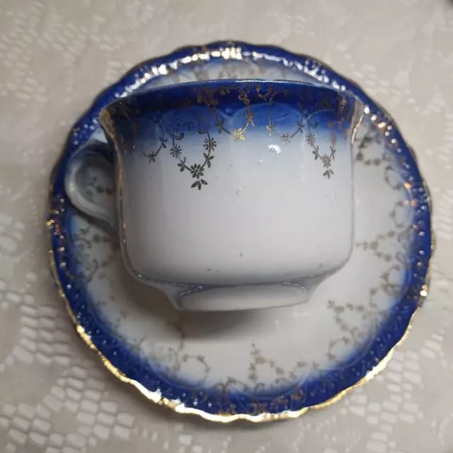 Antique Flow Blue China Tea Cup and Saucer Blue and Gold Ornate Detail