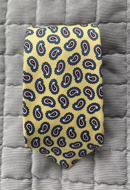 Vintage Barneys tie. Yellow with burgundy and blue paisley. Made in USA. Silk