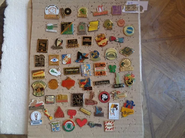 Job lot of 60 advertising relatedvintage metal lapel pins