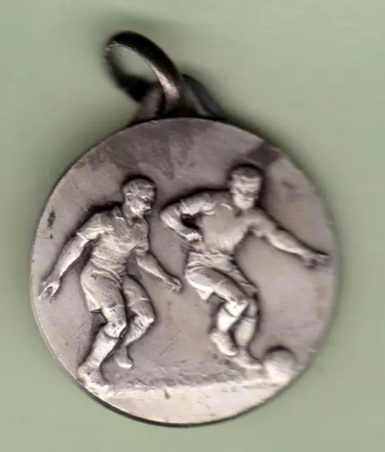 Médaille sportive de football en relief