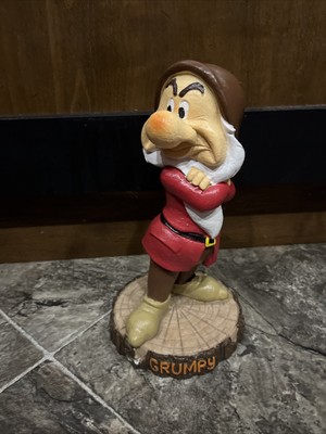 grumpy dwarf statue