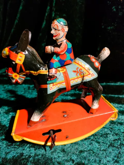Clown reitet auf Esel, Blechspielzeug von GAMA, Federmotor, 1920er/30er J.