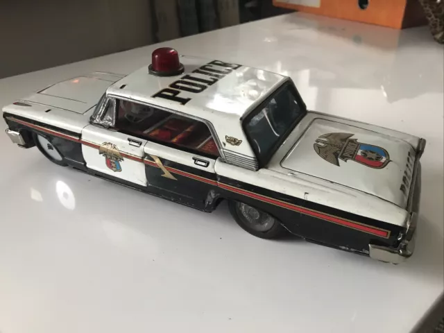 Vintage tinplate battery operated Ford Police Car Ichikco or Yonezawa,  1960’s