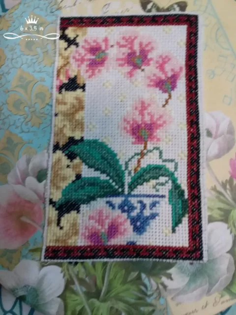 completed unframed cross  stitch  embroidery  sewing flowers