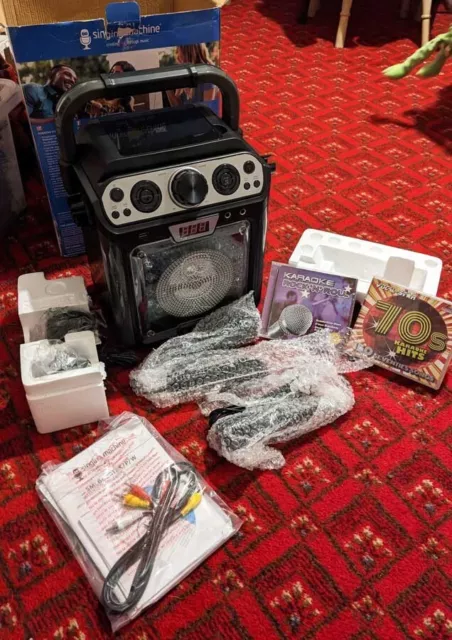 Brand New Karaoke/singing machine bluetooth & CD, LED lights, connects to TV. Brand New Karaoke/singing machine bluetooth & CD, LED lights, connects to TV.
