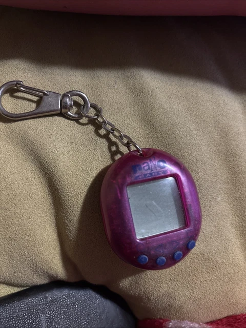 Tamagotchi Bootleg Vintage – Dinosaur Virtual Pet – Vert – Marque Bandai (blister Abîmé)