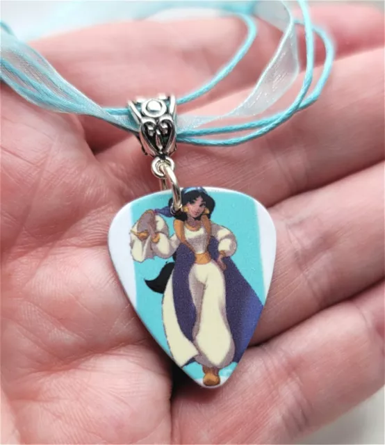 Aladdin's Jasmine Guitar Pick Necklace on Aqua Blue Ribbon Cord
