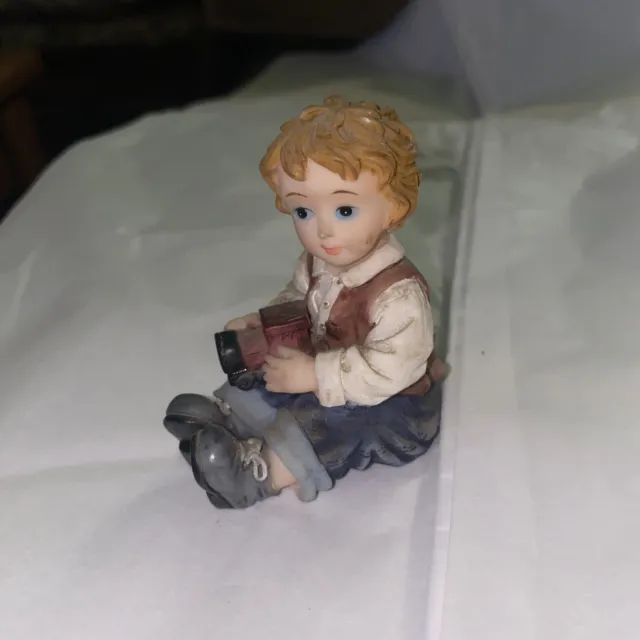 Boy Figurine Holding Train.  Montefiori Collection Italy Preowned.