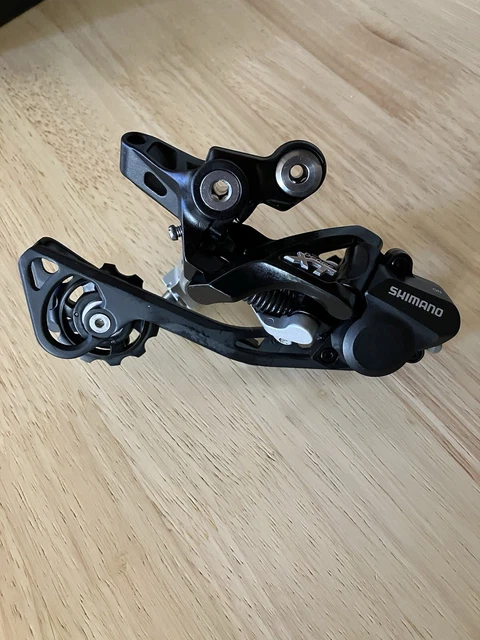 Shimano RD-M8250 Di2 Wireless Deore XT 12-speed rear mech HYPERGLIDE SGS long cage in Shimano RD-M8250 Di2 Wireless Deore XT 12-speed rear mech HYPERGLIDE SGS long cage in