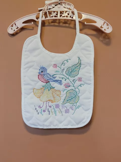 Flor de pájaros casera con aguja para babero bebé