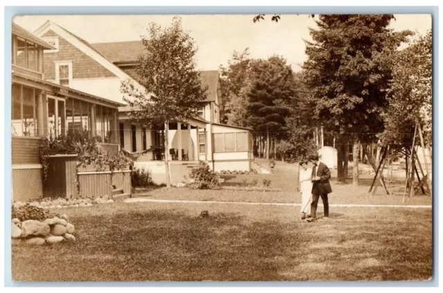 1913 Home Residence View Man Woman Topinabee MI RPPC Photo Posted Postcard