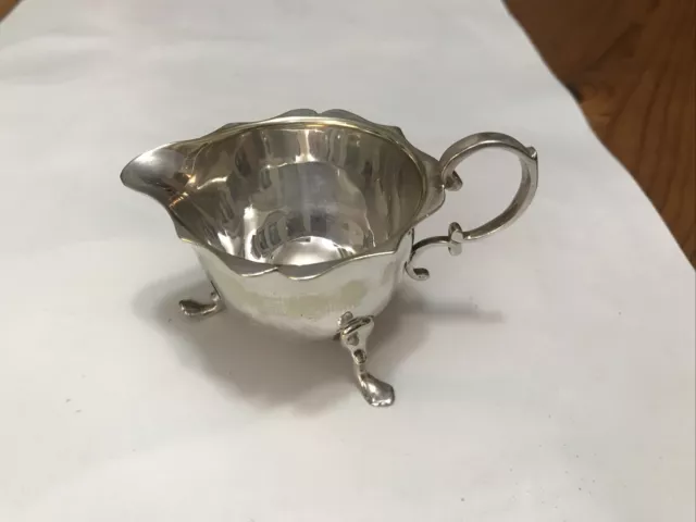 Small  cream jug,silver plate,5cm high ,3 legs,63gm,no dents,vintage