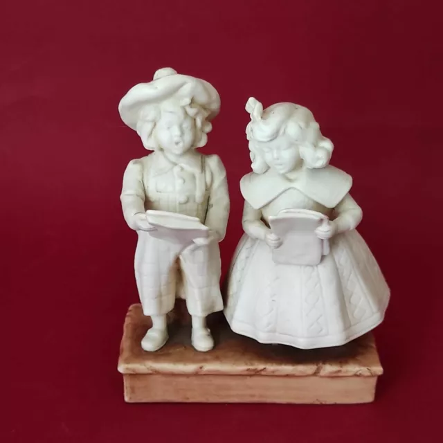 Statuine di bambini cantori in porcellana biscuit - Fine '800 - Inizio '900