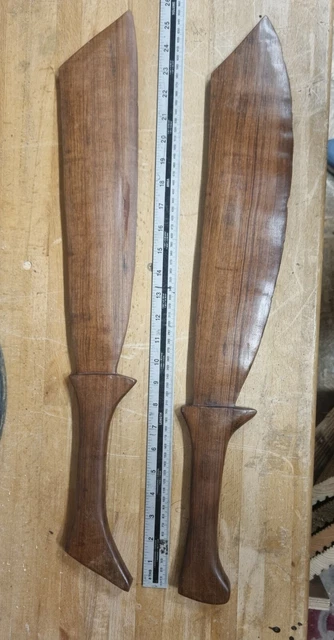 Tribal art, huge wood carved swords or machetes