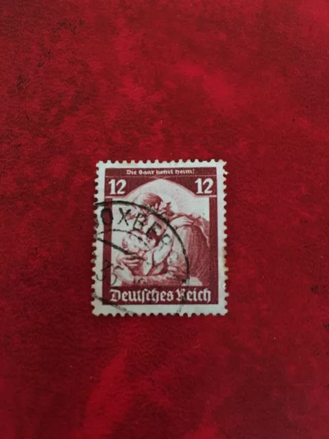 Briefmarke Deutsches Reich 12 Pfennig mit Stempel. „Die Baar kehrt heim!“