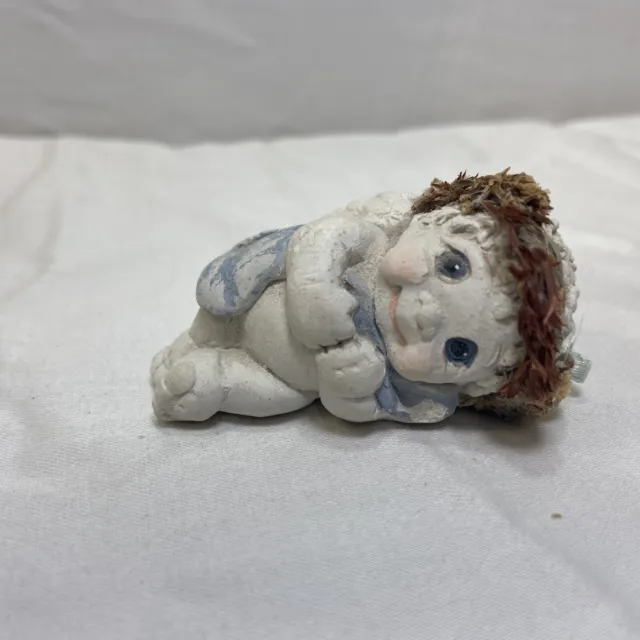 Dreamsicles Cherub Angel Figurine laying on side eyes open blanket Vintage ‘94