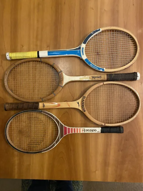 Four vintage wooden tennis rackets