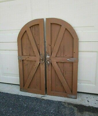 Pair of cocoa vintage inspired round top barn doors with hardware