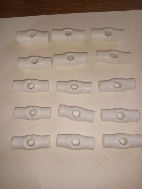 15 botones de palanca de plástico blanco de 25 mm.