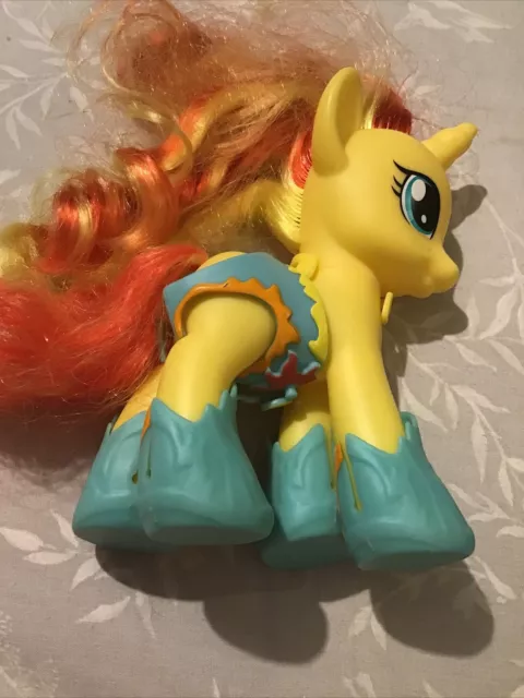 my little pony yellow horse with yellow and orange streaked hair and wearing sho 3