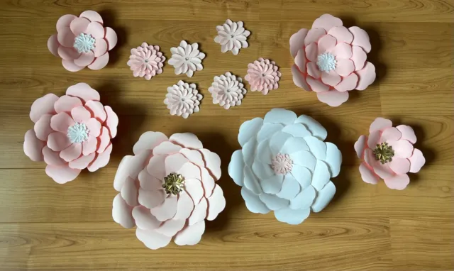 Decorative Paper Flowers.  Can be hung on wall individually. Total of 12.