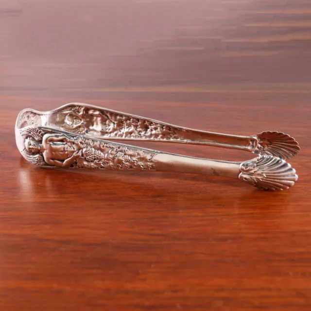 Early German 800 Silver Sugar, Ice Tongs Winged Man In The Grape & Vine 18Thc