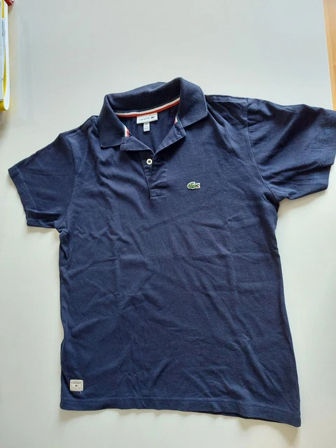 POLO LACOSTE SPORT Novak Djokovic noir. T. 14 ans. Comme neuf