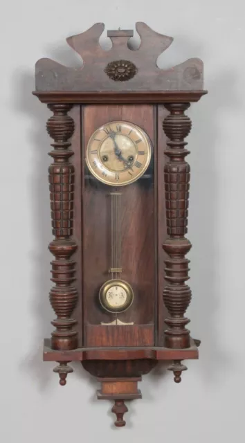 A Mahogany Wall Clock with Enamel Face Turned Columns and Carved Detail Hx86c