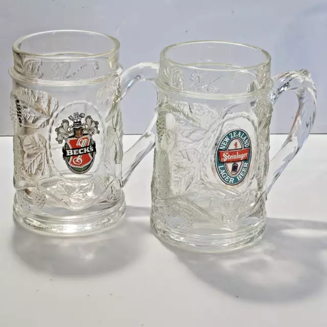 Lot of 2 Vintage Becks & Steinlager Beer Glass Mugs 5 1/4" Tall Ornate Grapes