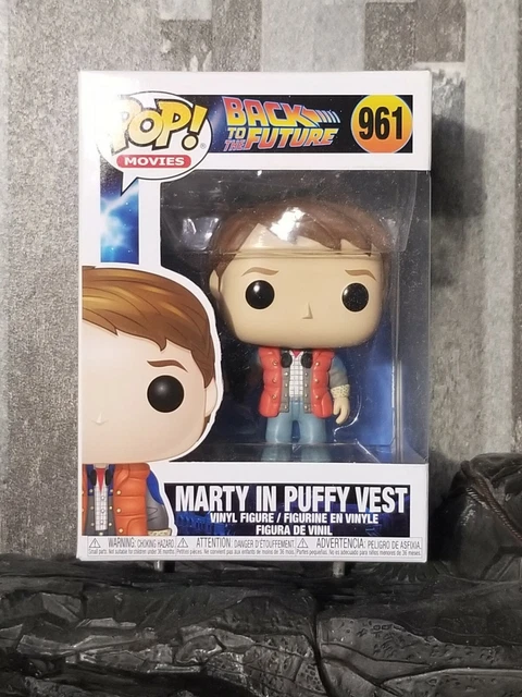 Figurine Funko Pop Marty McFly avec son "gilet de sauvetage" et sa caméra (BTTF)