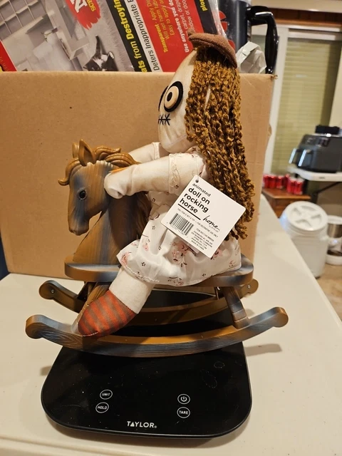 Halloween doll on rocking horse outlet
