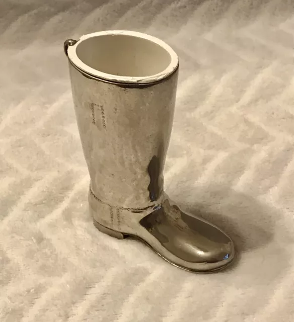 A vintage small  silver plated boot vase, very cute