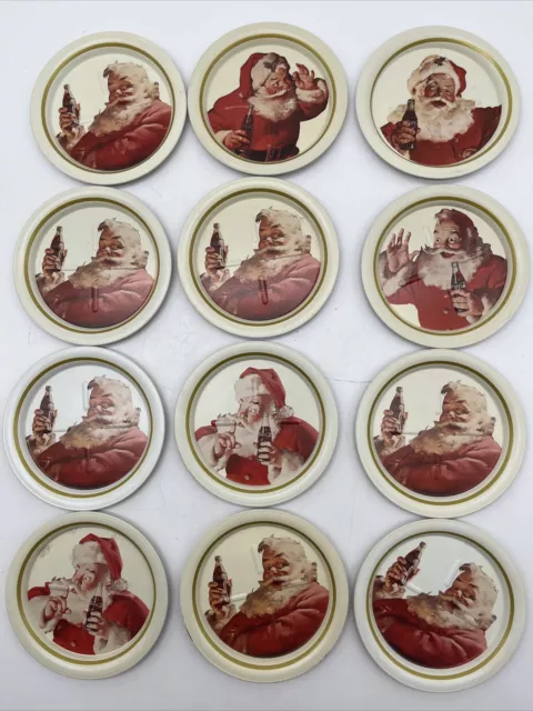 Coca Cola SANTA CLAUS Coaster Set of 12 Metal Tin 1980s Coca-Cola Co.