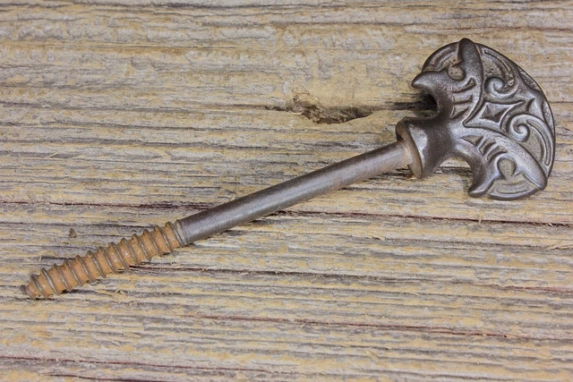 old screw nail curtain tieback decorated cast iron head vintage casket