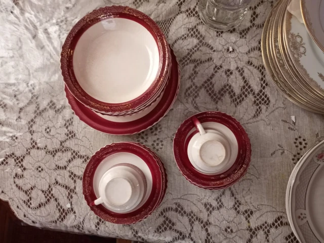 The French Saxon China Co Q. E. Maroon 23 piece set 22K Gold Floral Design 