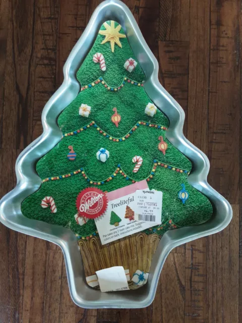 https://www.picclickimg.com/TPYAAOSwP79jJ1Ub/Wilton-TREELITEFUL-Cake-Pan-Christmas-Treepan-takes-one.webp
