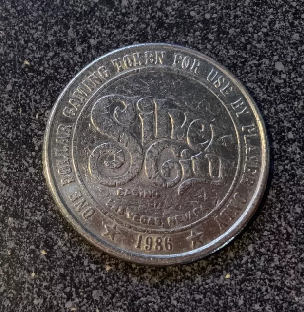 The SILVER CITY Casino $1.00 1986 casino slot gaming token / coin Las Vegas NV